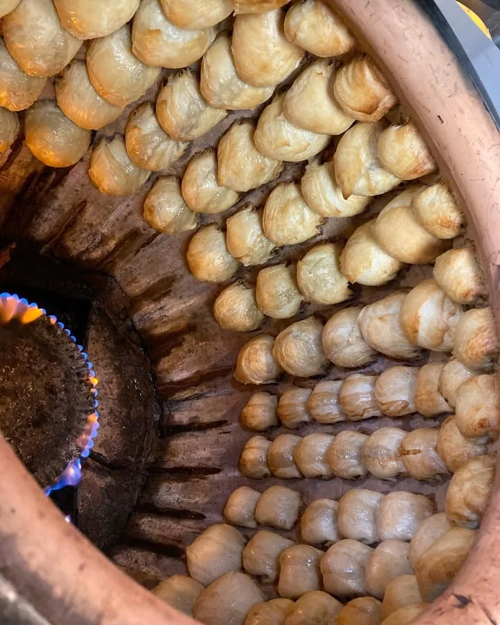 Samsa baking in the tandoor at Oasis