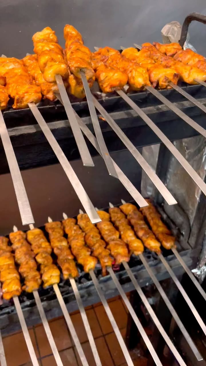Kebabs cooking over the charcoal grill at Oasis